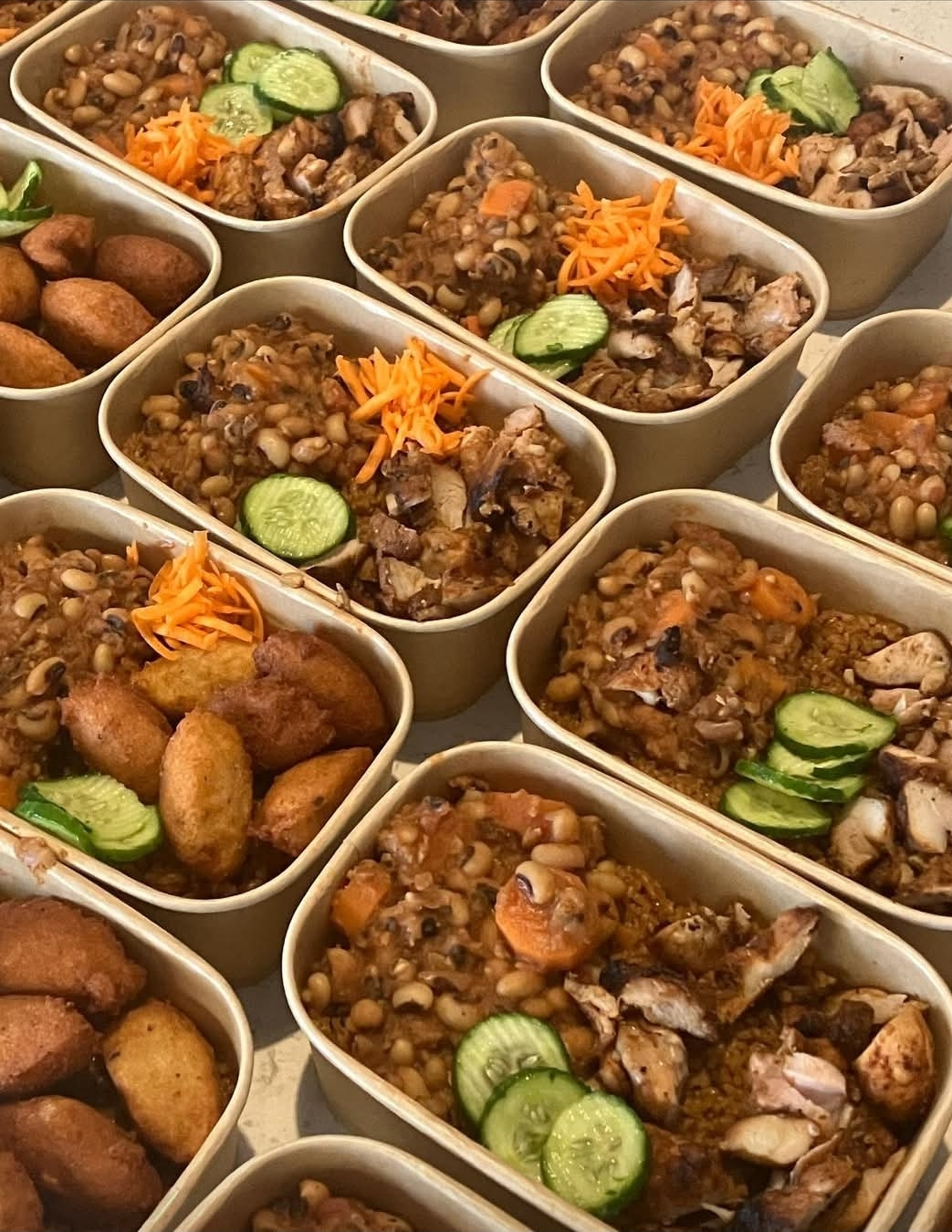 Senegalese catering bowls with Thieboudienne and accara